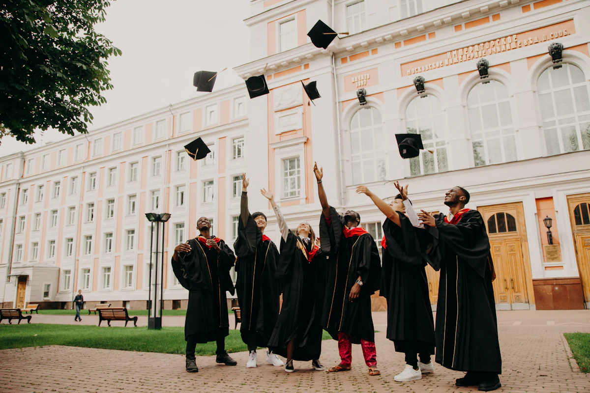 Graduates throwing their caps in celebration